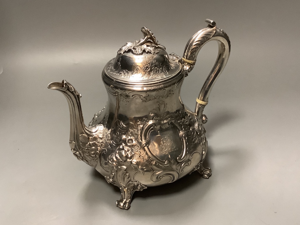 A Victorian embossed silver coffee pot, by George Ivory, London 1857 height 18.2 cm